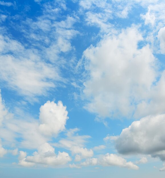 White fluffy clouds in the blue sky