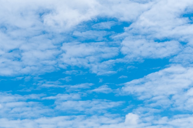 White fluffy clouds on blue sky