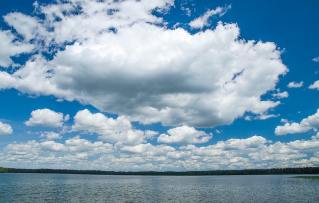 White fluffy clouds in the deep blue summer sky