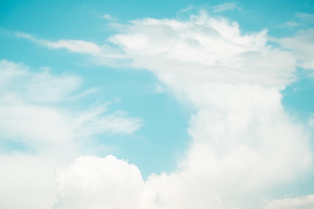 white fluffy clouds sky background with blue sky background