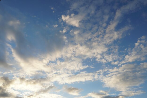 White fluffy clouds in the sky Blue sky and cloud cover on a sunny summer day Empty background copy space