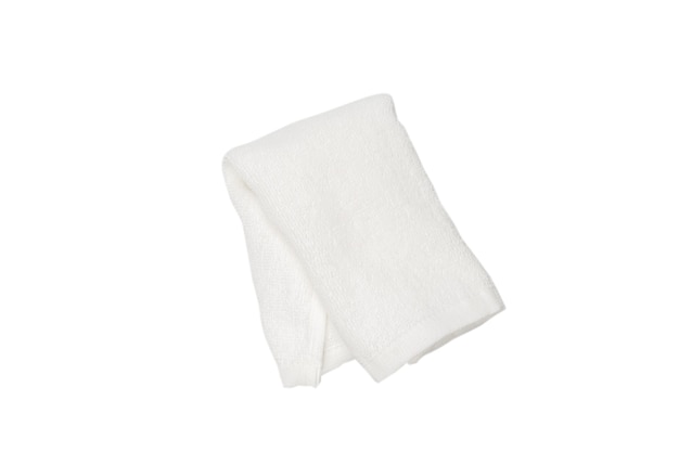 White fluffy cotton towel isolated on a white background. Spa and resort.