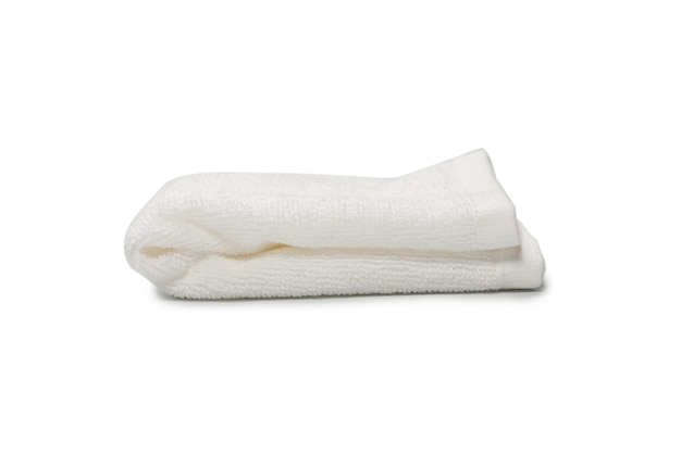 White fluffy cotton towel isolated on a white background. Spa and resort.