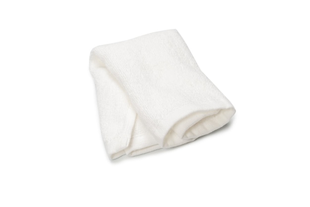 White fluffy cotton towel isolated on a white surface. Spa and resort.