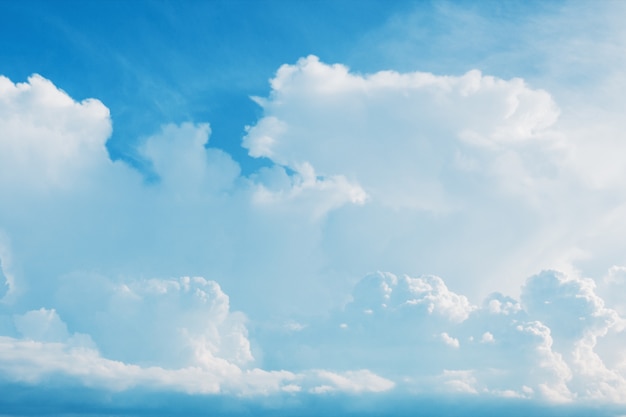 White fluffy cumulus clouds flying