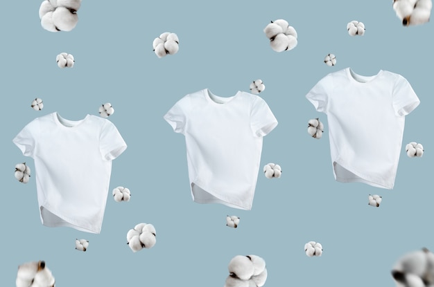 White flying cotton t-shirt isolated on blue background. clean
white t-shirt for women or men. unisex. cotton flowers. branding
clothes front view. mock up for your design. classic white basic
t-shirt