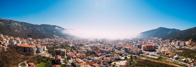 White fog is coming from the sea to the city of budva in montenegro