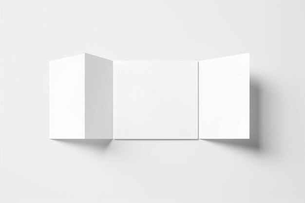 Photo a white folded brochure on a white wall