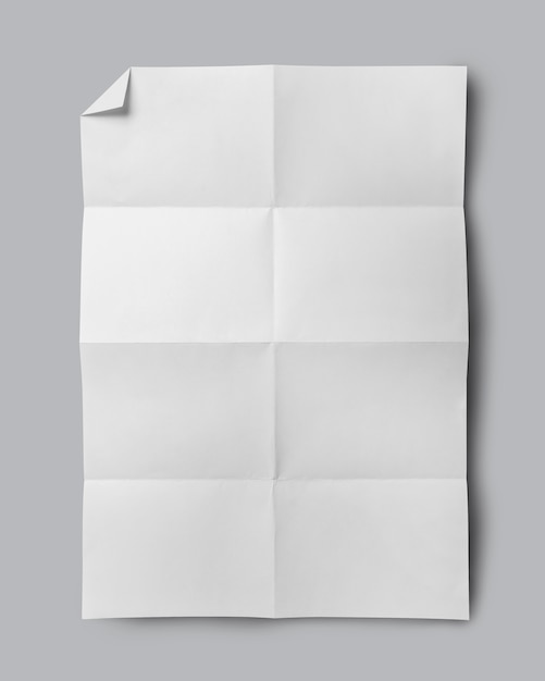 White folded paper isolated on gray background