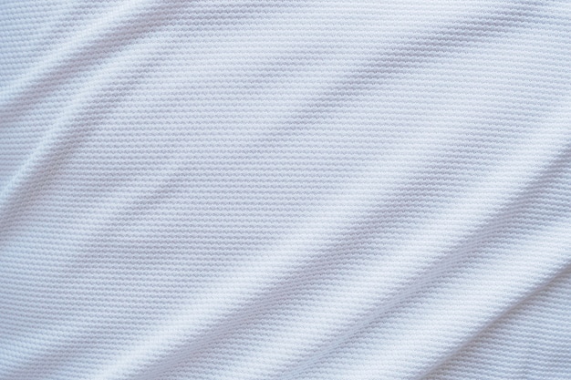 Photo white football jersey clothing fabric texture sports wear background, close up