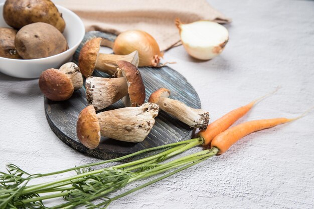 White forest mushrooms on a light background cooking organic\
mushrooms