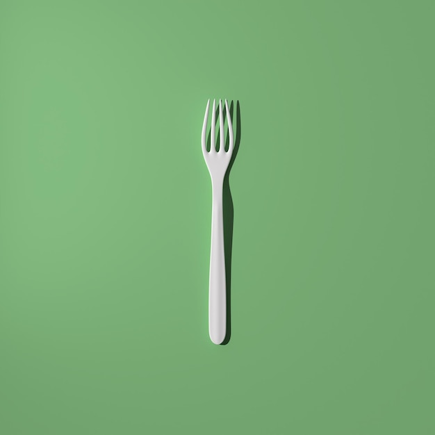 White fork on a green background