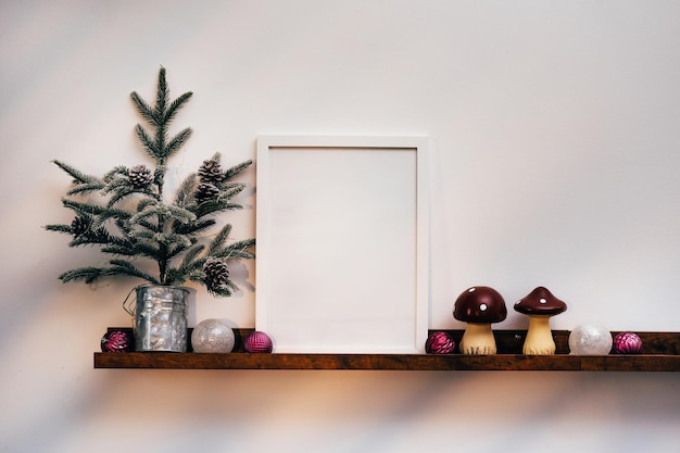 White frame and Christmas decorations mock up