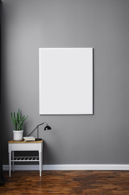 A white frame on a grey wall with a plant on it.