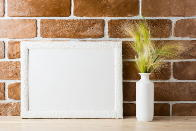 White frame mockup with ornamental grass in styled vase