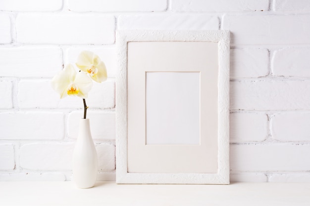 White frame mockup with soft yellow orchid in vase