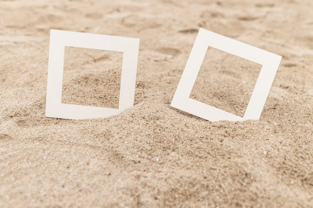 White frame placed on the sand beach