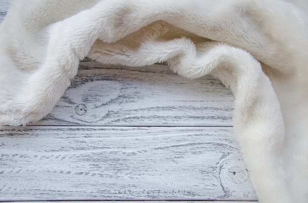 White fur on a wooden background