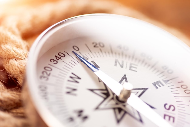 White geographic comp close up Compass and rope