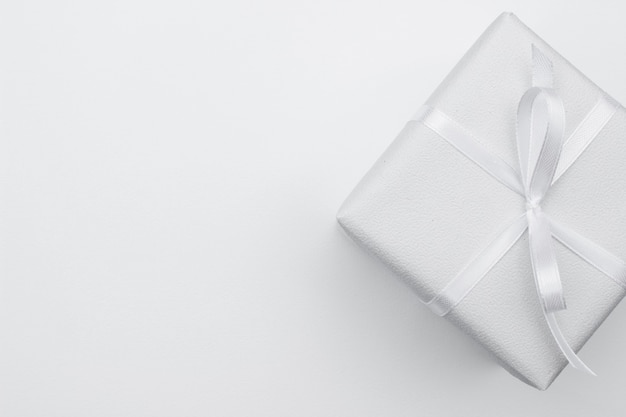 White gift box on paper with copy space.