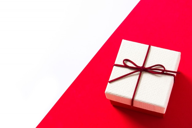 White gift box on red and white