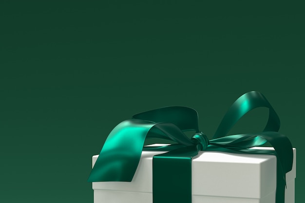 White gift box with green ribbon and bow isolated