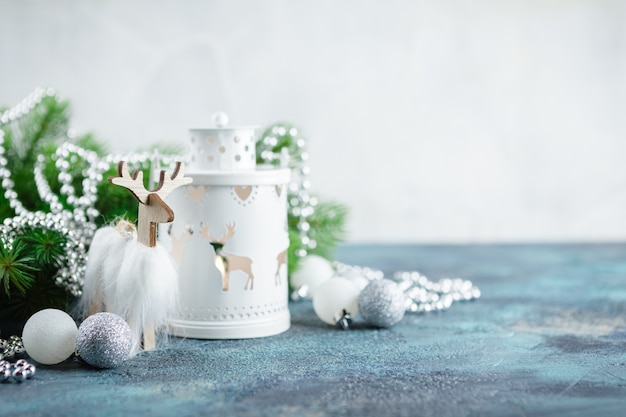 white glass balls and toys, wooden decoration, floor lamp light, wooden deer and pocket whatches