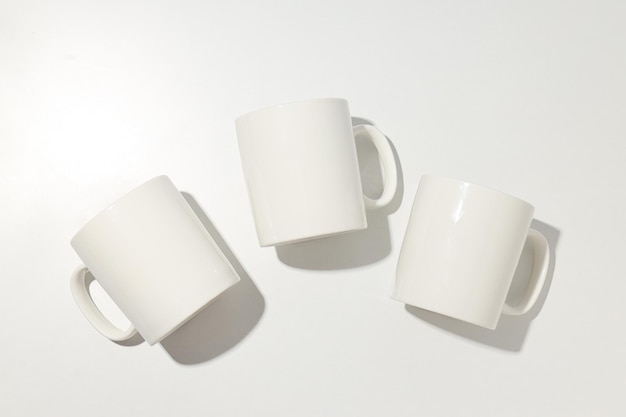White glass cups on a light background