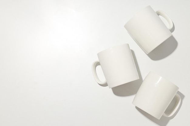 White glass cups on a light background
