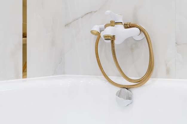 White and gold metal bathroom faucet