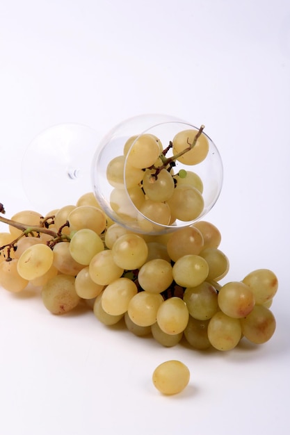 White grapes on glass Wine glasses, white background