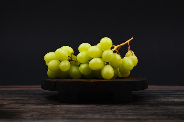 White grapes on a wooden board