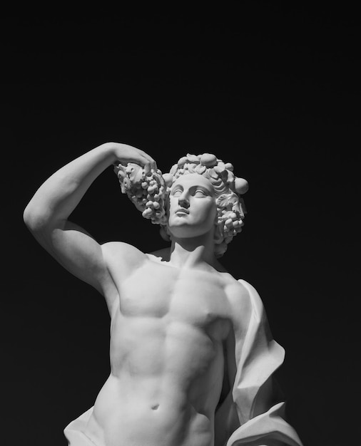 white Greek statue on a black background closeup