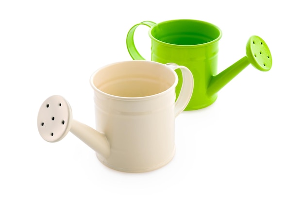 White and green watering cans