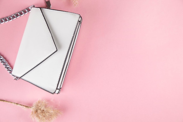 White handbag with grass