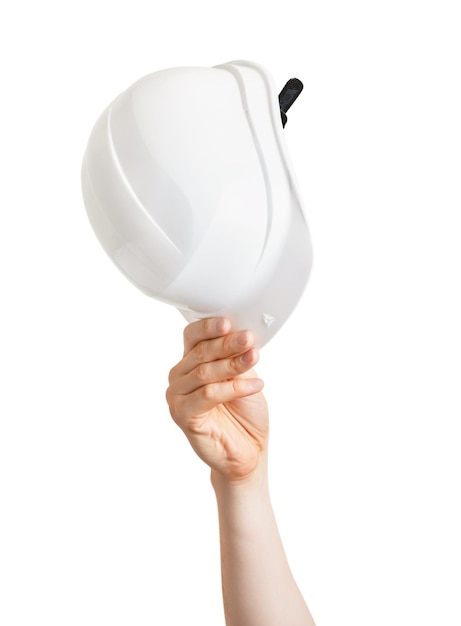 White hard hat in a male hand on a white isolated background