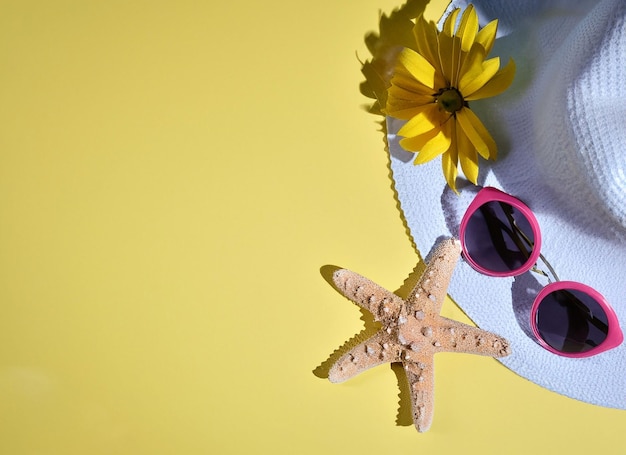 A white hat with a starfish and a hat with a starfish on it.