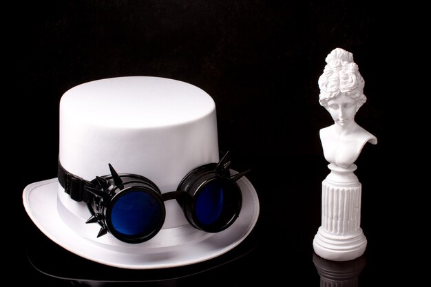 white hat with steampunk black glasses