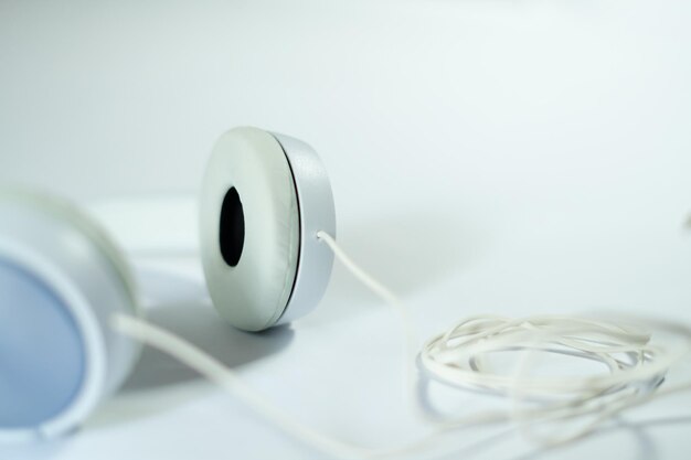 White headphone with cable isolated with white background