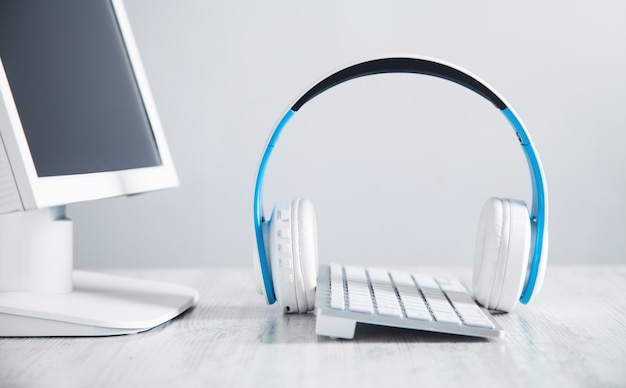 White headphones with a computer. Business desk