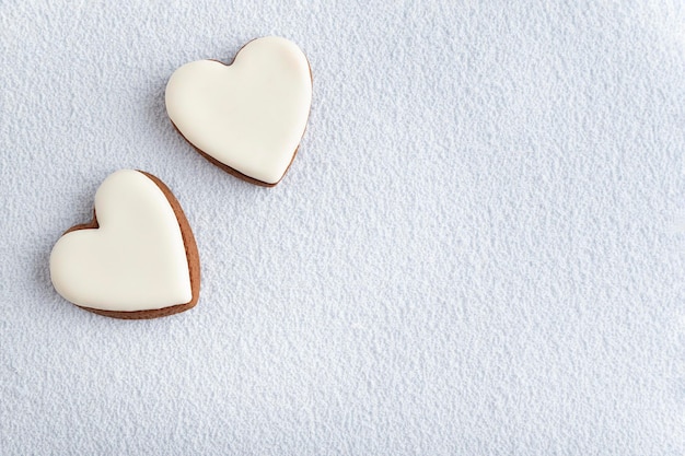 White heart shape cookies for Mothers day, Womans day or Valentines Day. Copy space.