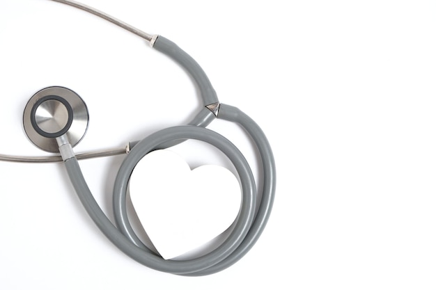 White heart and stethoscope on white backgroundHeart disease medical examination