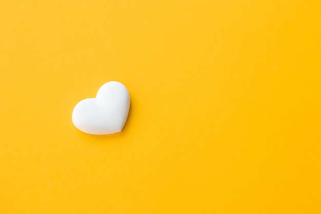 White heart on yellow background