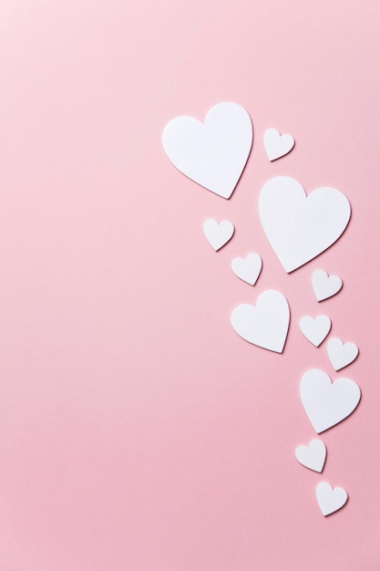 White hearts on a pastel pink background Valentine's day Mother's day background