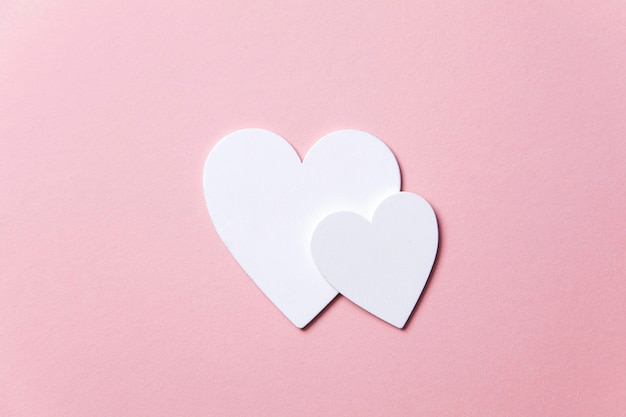 White hearts on a pastel pink background valentine's day mother's day background