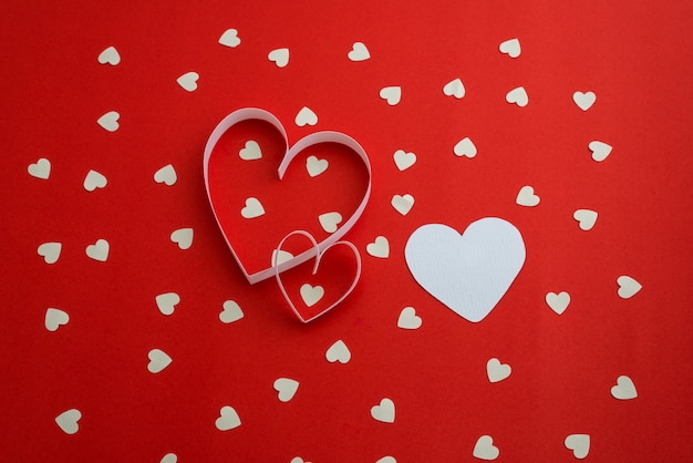 White hearts on red background