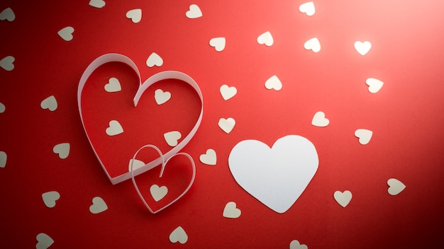 White hearts on red background