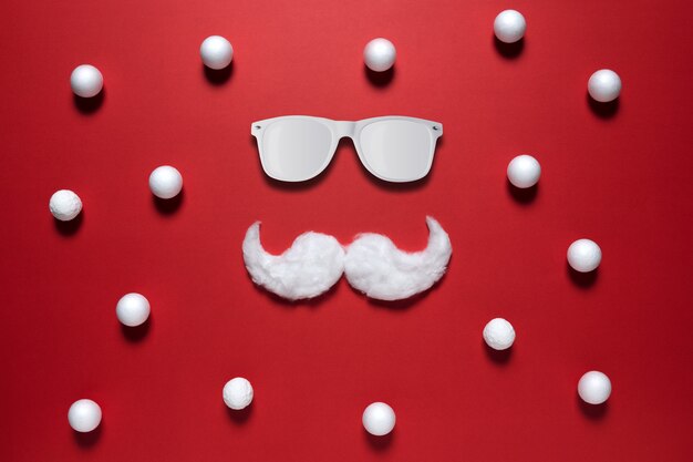 White hipster mustache of Santa Claus with sunglasses