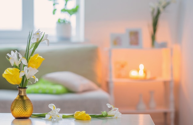 White home interior with spring flowers and decorations