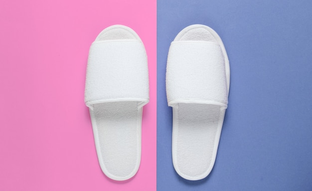 White hotel sleeping slippers on colored.